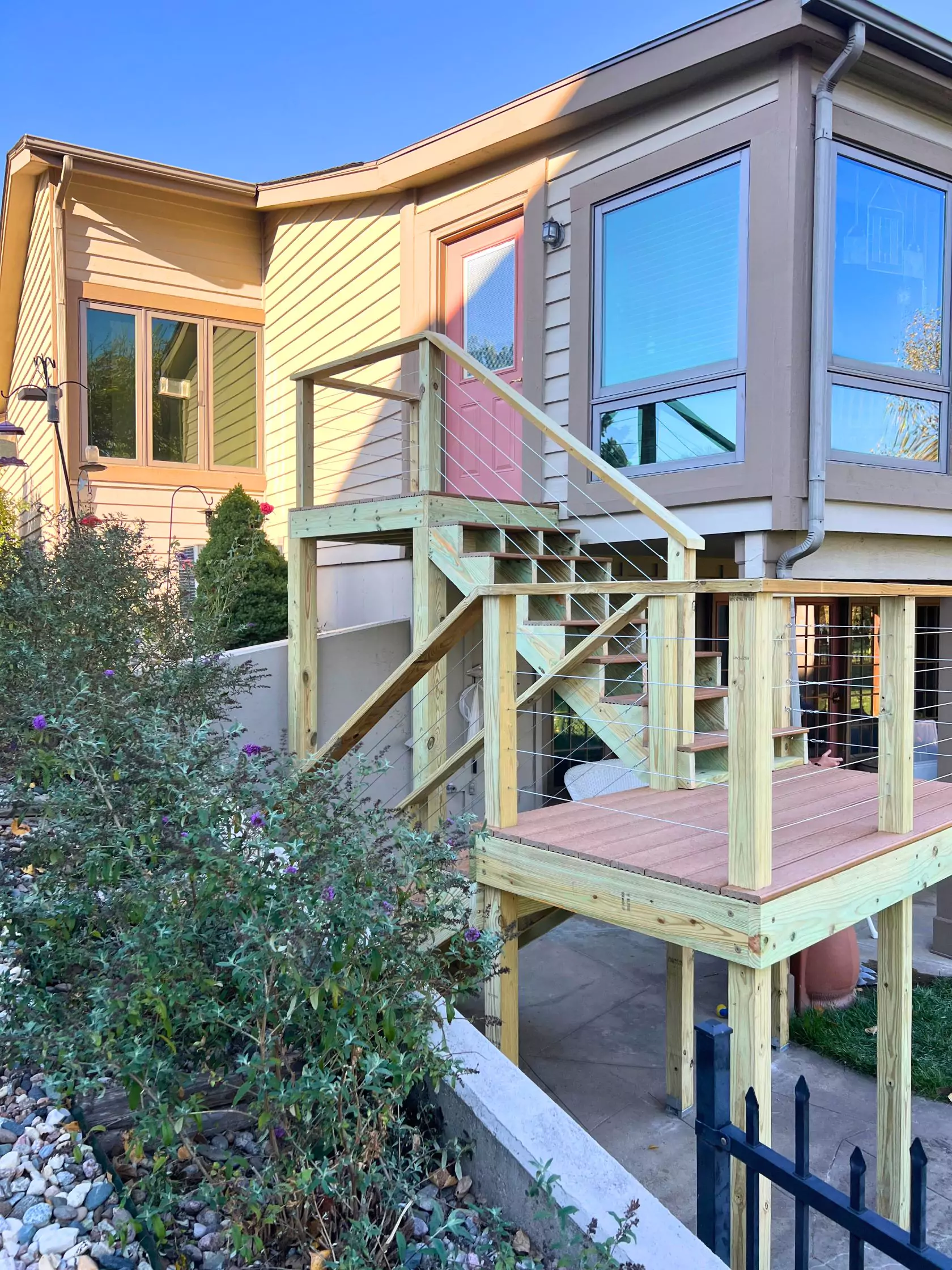 Beautiful two-level deck and staircase leading to a door